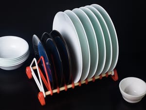 Vertical Plate Rack on table filled with plates next to bowls
